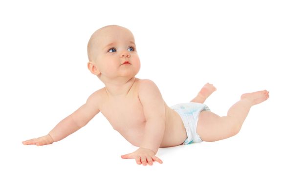 Newborn child lying on the ground watching to the side. All isolated on white background.