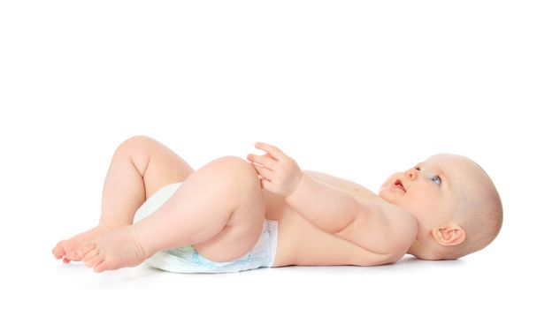 Newborn child lying on the ground. All isolated on white background.