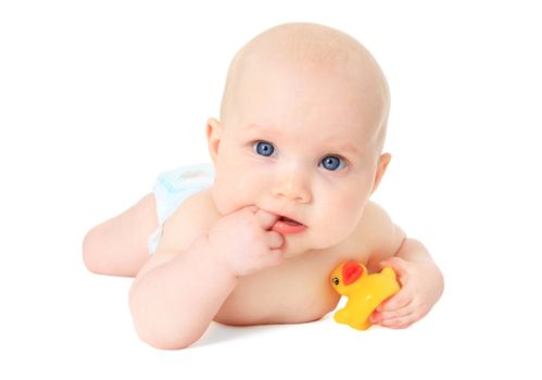 Newborn child playing with a rubber duck. All isolated on white background.