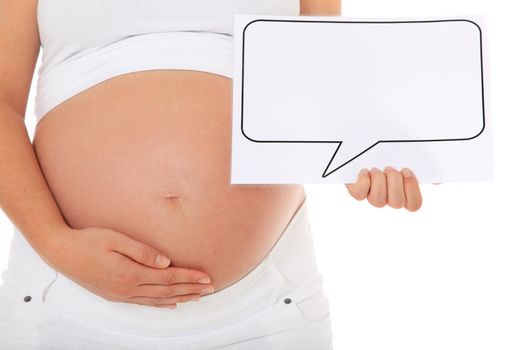 Pregnant woman holding speech balloon at her baby bump. All on white background.