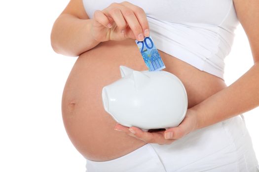 Pregnant woman puts money in piggy bank. All on white background.