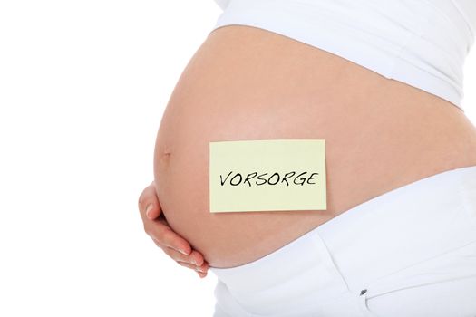 Pregnant woman with post-it note showing the German term Vorsorge (Engl.: prevention). All on white background.