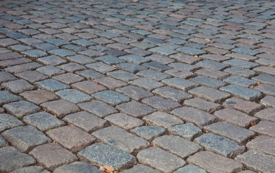 Grey cobbled pavement, background texture.