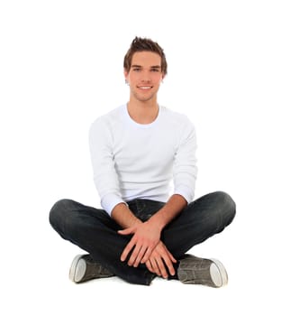 Attractive young man sitting. All on white background.