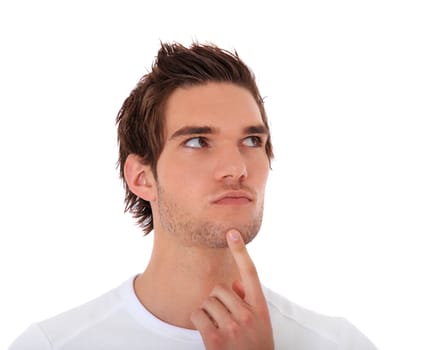 Attractive young man deliberates a decision. All on white background.