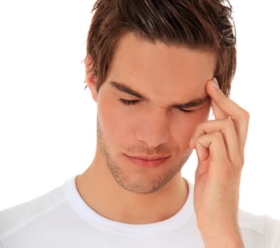 Attractive young man suffers from a headache. All on white background.