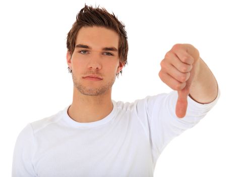 Attractive young man showing thumbs down. All on white background.