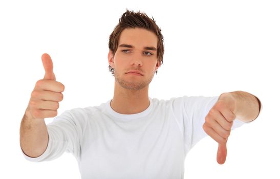 Attractive young man showing thumbs up and thumbs down. All on white background.