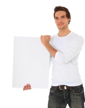 Attractive young man holding blank sign. All on white background.