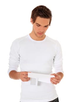 Attractive young man reading a letter. All on white background.