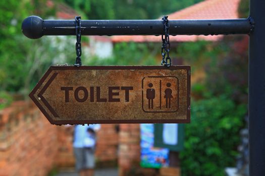 vintage plate of restroom sign
