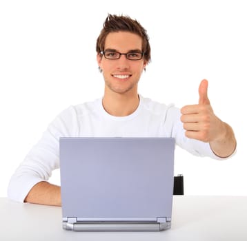 Smiling young guy using notebook computer. All on white background.