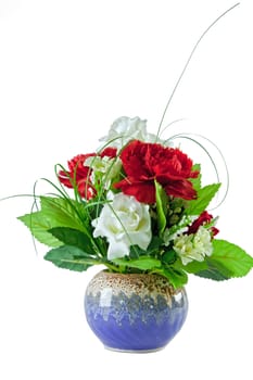 beautiful red and white roses bouquet in blue vase on white background, vertical