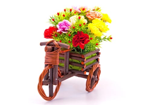 beautiful and colorful flower bouquet in wooden basket in car shape