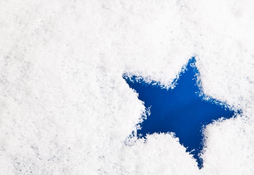 Blue star in snow.