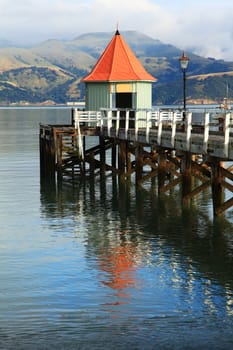 jetty pier building on lake at Akaroa New Zealand