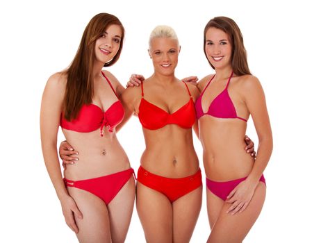 Three beautiful young woman in bikini standing next to each other. All on white background.