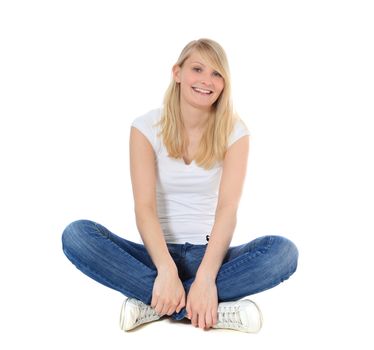 Attractive young woman sitting on the ground. All on white background.