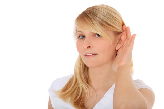 Attractive teenage girl tries to hear something. All on white background.