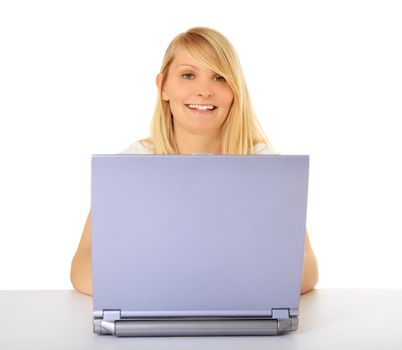 Attractive teenage girl using notebook computer. All on white background.