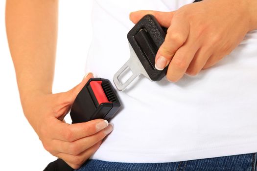 A person fastens the seat belt. All on white background.