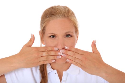 Attractive woman keeps her mouth shut. All on white background.