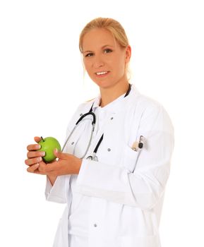 Attractive doctor holding a green apple. All on white background.