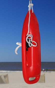 Red life buoy at the beach.