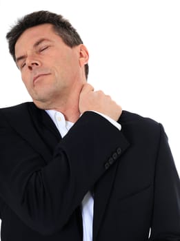 Attractive middle-aged man suffering from neck pain. All on white background.