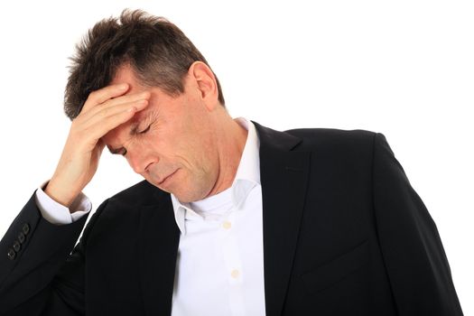 Attractive middle-aged man suffering from headache. All on white background.