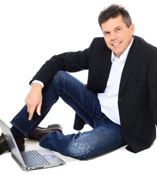 Attractive middle-aged man using notebook computer. All on white background.
