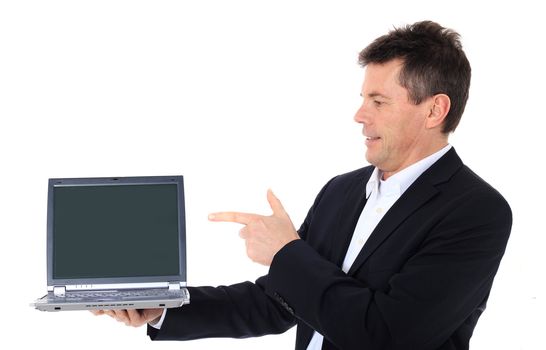 Attractive middle-aged man pointing on notebook computer. All on white background.