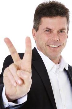 Attractive middle-aged man making victory sign. All on white background.