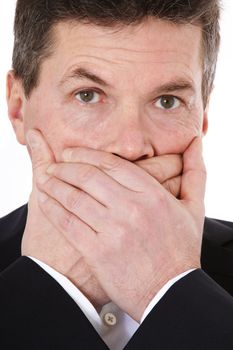 Attractive middle-aged man shuts his mouth. All on white background.