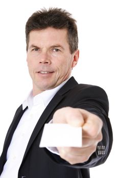 Attractive middle-aged man giving business card. All on white background.