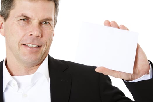 Attractive middle-aged man holding blank white card. All on white background.