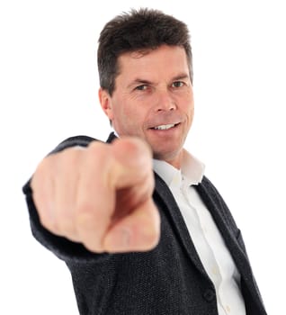 Attractive middle-aged man pointing with finger. All on white background. Selective focus on finger in foreground.