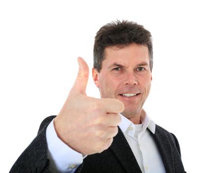 Attractive middle-aged man making thumbs up sign. All on white background.  Selective focus on thumb in foreground.