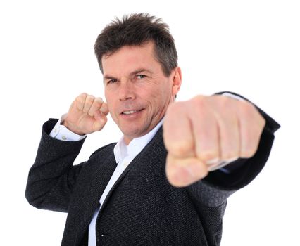 Attractive middle-aged man in battle stance. All on white background.