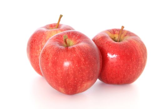 Red apples on white background.