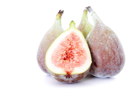 Ripe figs on white background.