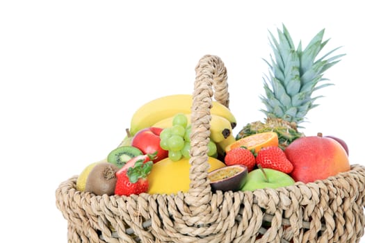 Basket full of various ripe fruits.