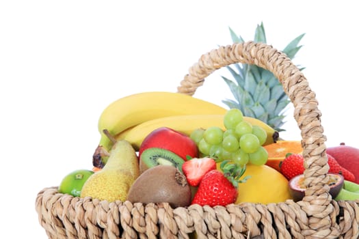 Basket full of various ripe fruits.