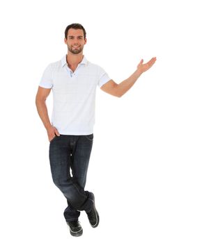 Full length shot of an attractive man pointing to the side. All on white background.