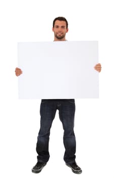 Attractive young man holding blank white sign. All on white background.