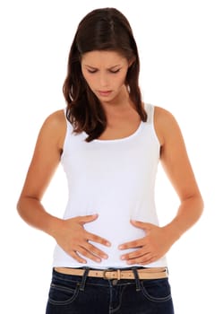 Attractive young woman suffers from stomachache. All on white background.