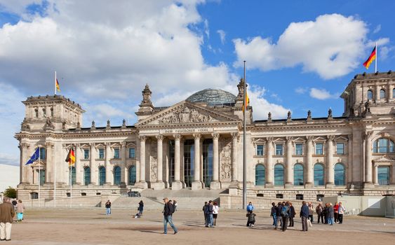 Tourists near Reichstag, September 23, 2012, Berlin, Germany. After moving of Bundestag to Berlin in 1999 building of Reichstag was visited by over 13 mil. people from all over world