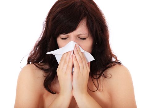 Attractive young woman suffers from hayfever. All on white background.