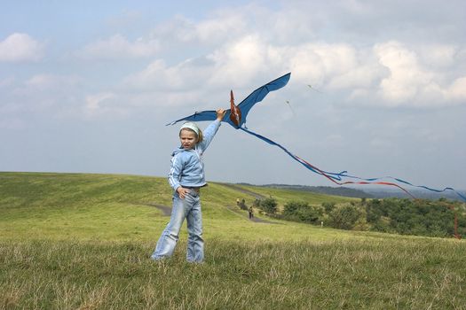 Child flying kite outdoor