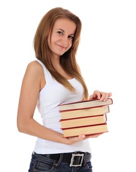 Attractive student holding pile of books. All on white background.